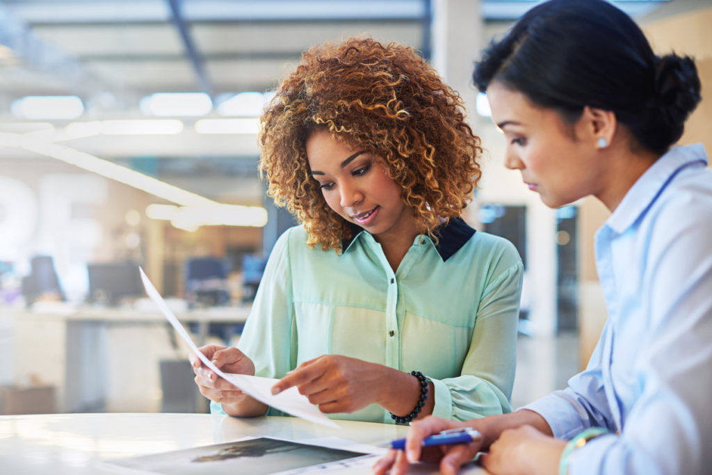 Shot of two businesswoman working together in an office