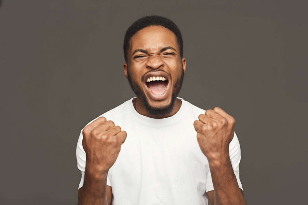 Success, excited black man with happy facial expression