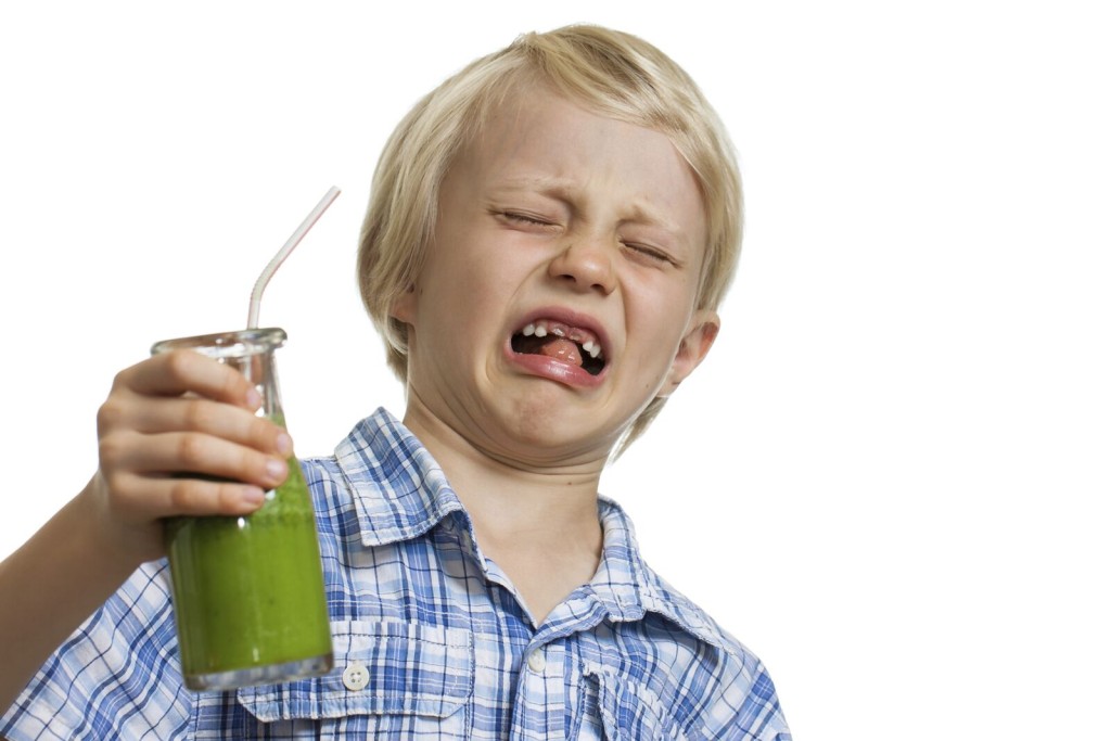 Child grossed out by green juice in glass bottle