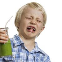 Child grossed out by green juice in glass bottle